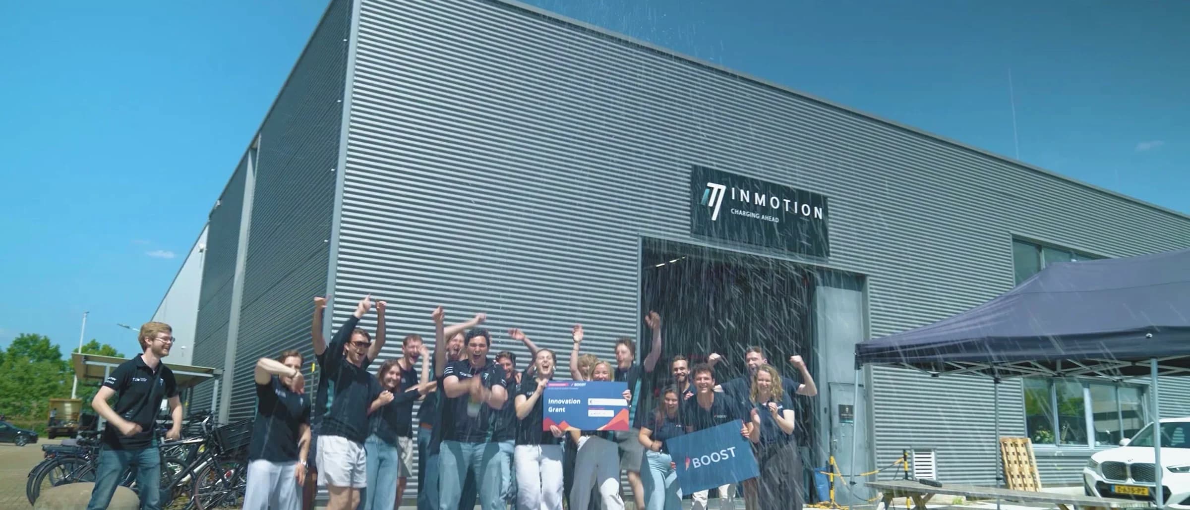 Winning teams celebrating the Boost Innovation Grant surprise reveal