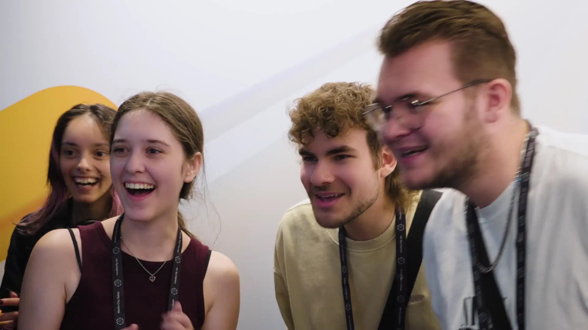 Group of guests reacting as their WeSmile AI portrait appears